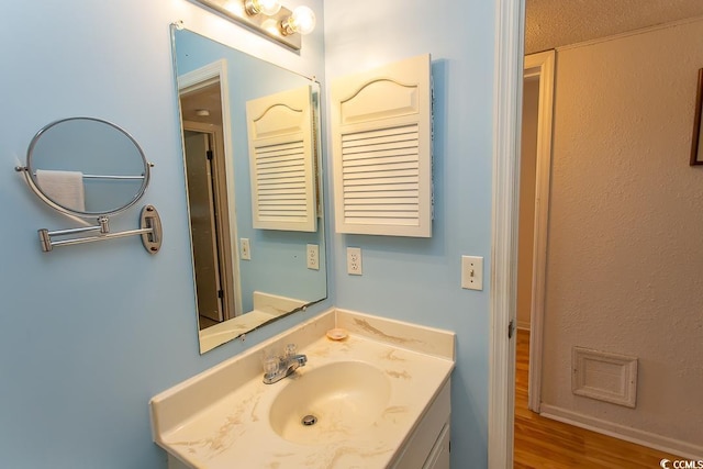 bathroom featuring vanity and wood finished floors