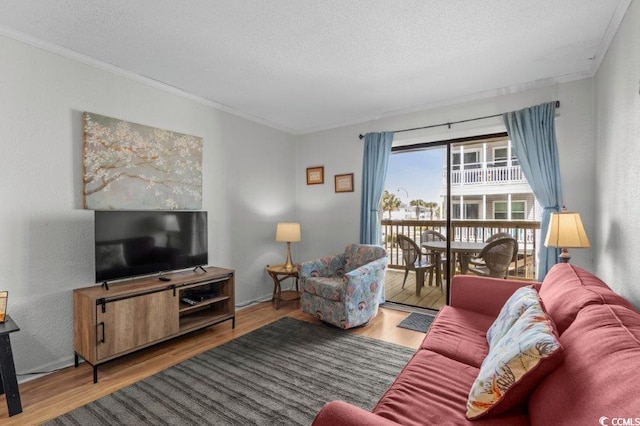 4305 S Ocean Blvd Unit 106, North Myrtle Beach, SC 29582 - living room with wood finished floors, crown molding, and a textured ceiling