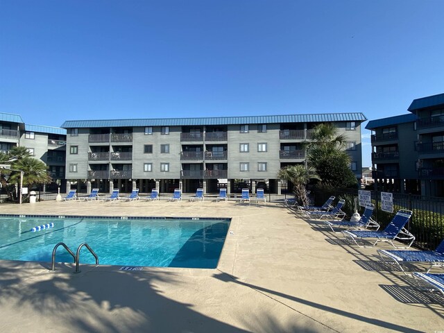 6001 N Ocean Blvd Unit 242, North Myrtle Beach, SC 29582 - view of swimming pool with a patio