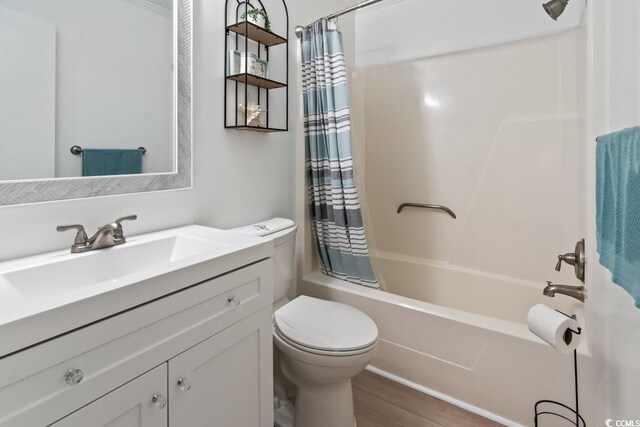 6001 N Ocean Blvd Unit 242, North Myrtle Beach, SC 29582 - full bathroom featuring vanity, hardwood / wood-style flooring, toilet, and shower / bath combo with shower curtain