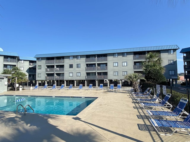 view of swimming pool with a patio