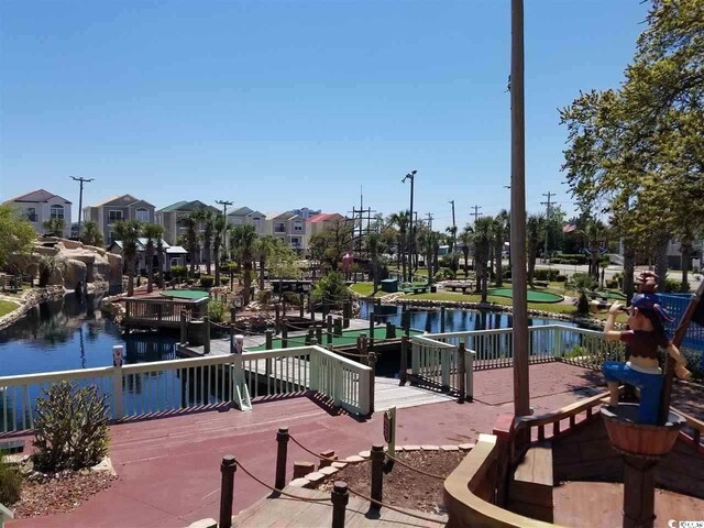 6001 N Ocean Blvd Unit 242, North Myrtle Beach, SC 29582 - view of dock with a deck with water view