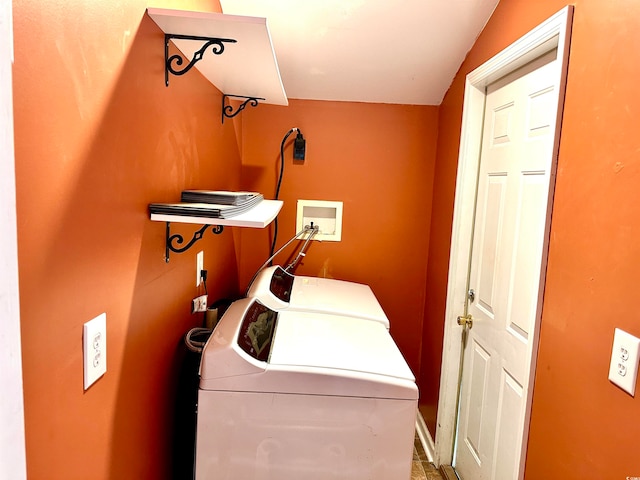 washroom featuring washing machine and clothes dryer