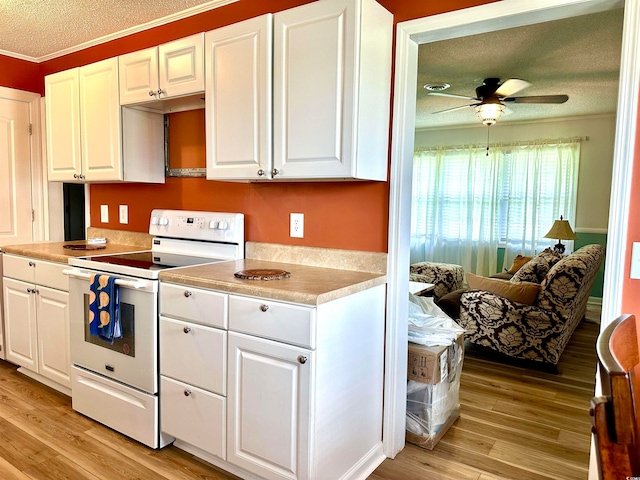 kitchen with ceiling fan, white cabinets, light hardwood / wood-style flooring, and white range with electric cooktop