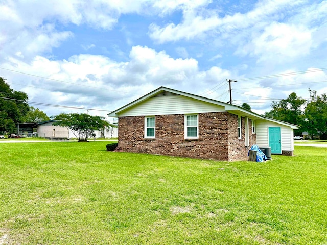 view of property exterior featuring a lawn