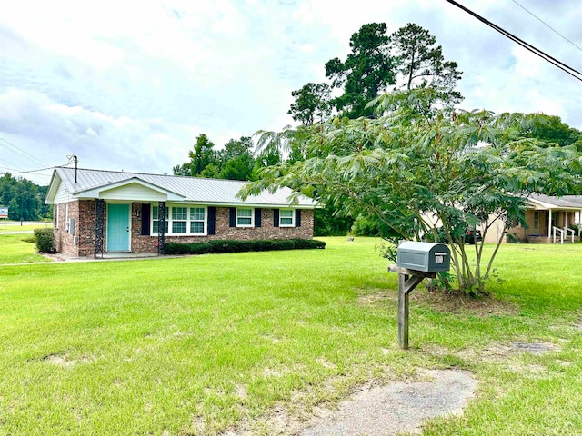 single story home featuring a front yard