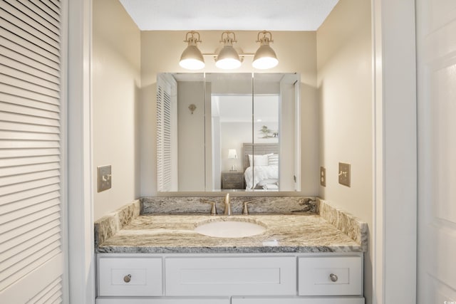 bathroom featuring vanity and a textured ceiling