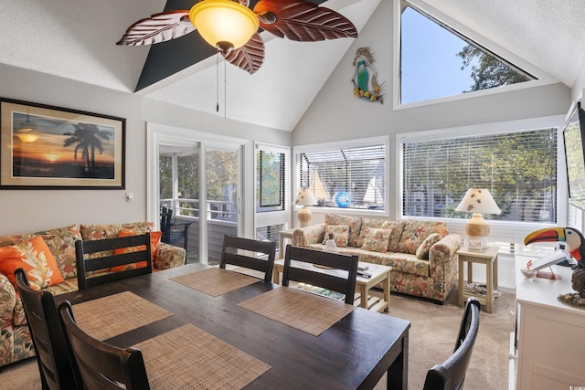 sunroom / solarium featuring vaulted ceiling, ceiling fan, and plenty of natural light