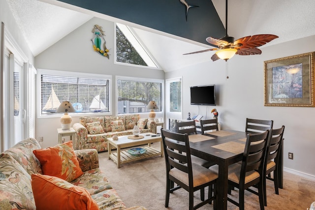 carpeted living room featuring high vaulted ceiling, ceiling fan, and a textured ceiling