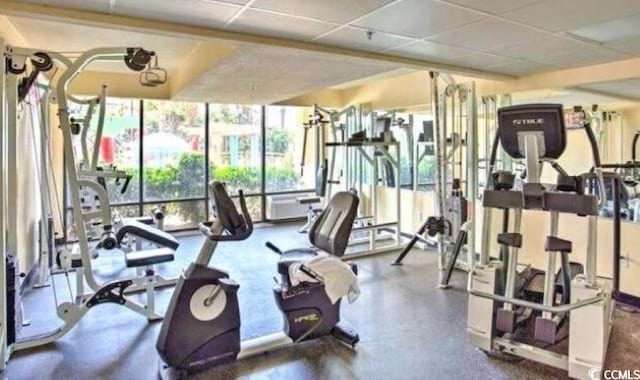 gym with a paneled ceiling