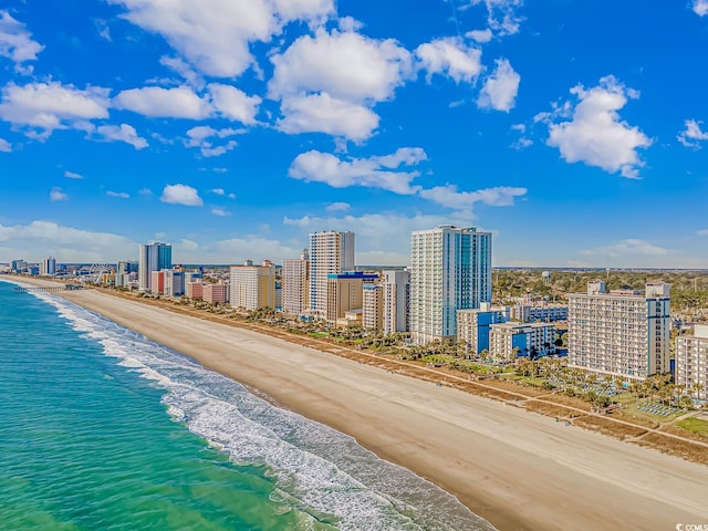 birds eye view of property featuring a view of the beach and a water view