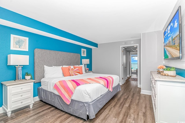 bedroom with hardwood / wood-style floors