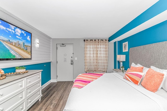 bedroom featuring dark hardwood / wood-style floors