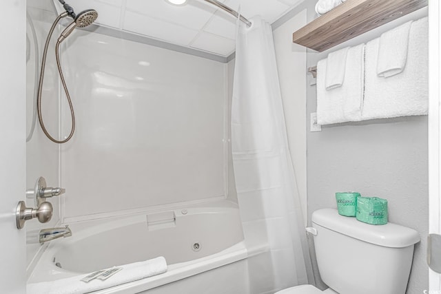 bathroom with shower / bath combo with shower curtain and toilet