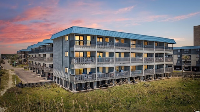 view of outdoor building at dusk