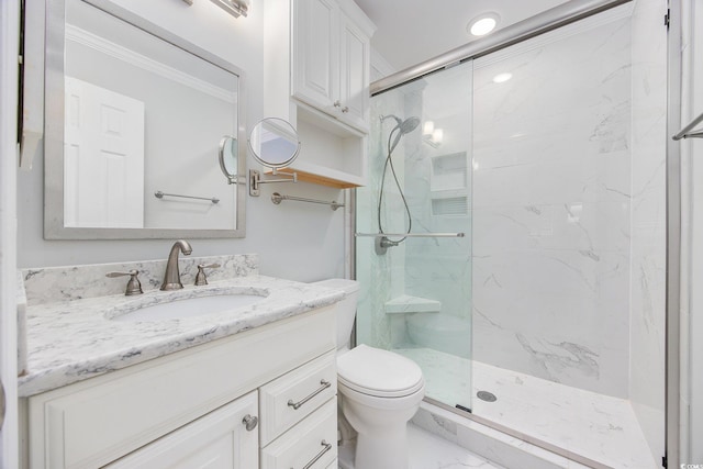 bathroom featuring marble finish floor, a marble finish shower, toilet, ornamental molding, and vanity