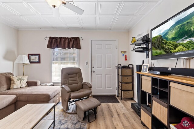 living room with ceiling fan and light hardwood / wood-style flooring