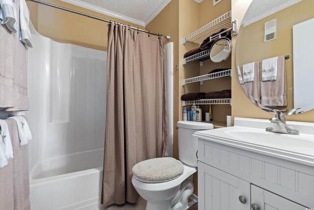 full bathroom featuring shower / tub combo with curtain, a textured ceiling, vanity, crown molding, and toilet