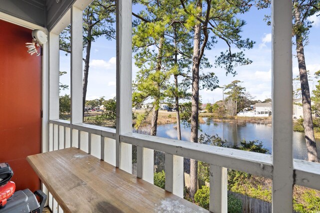 balcony featuring a water view