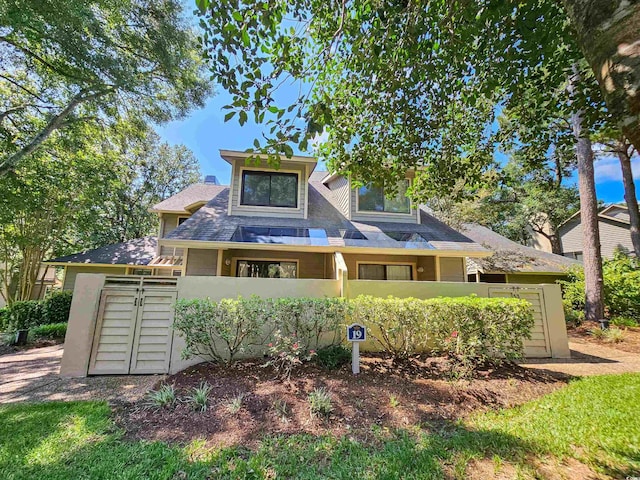 view of front of house with a fenced front yard and an attached garage