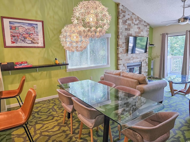 dining space with carpet, a fireplace, a textured ceiling, and lofted ceiling