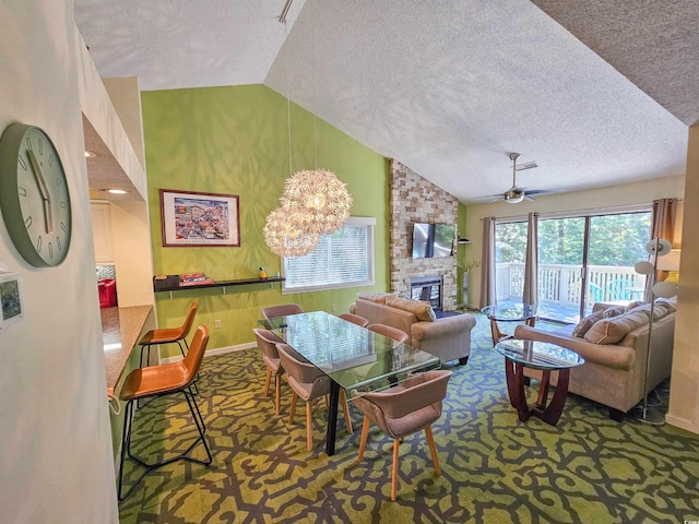 living room featuring a fireplace, lofted ceiling, and a textured ceiling