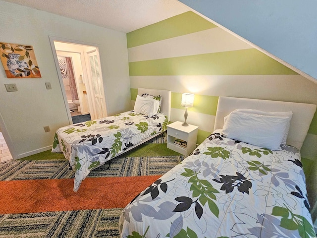 carpeted bedroom with a textured ceiling