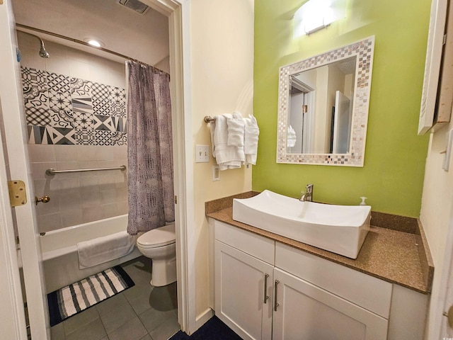 full bathroom featuring tile patterned flooring, toilet, vanity, and shower / bathtub combination with curtain