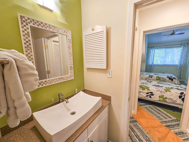 bathroom featuring ceiling fan and vanity