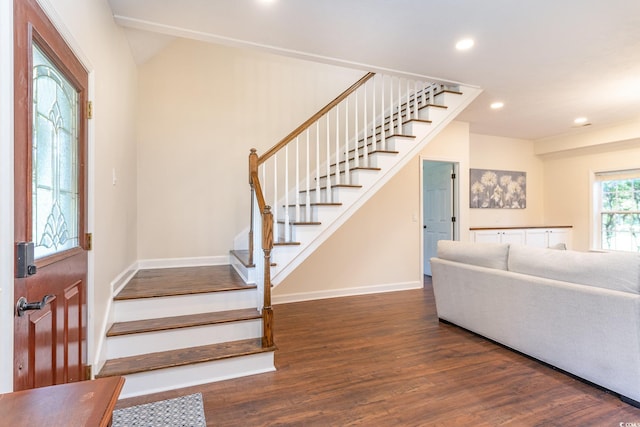 foyer entrance with stairway, recessed lighting, wood finished floors, and baseboards