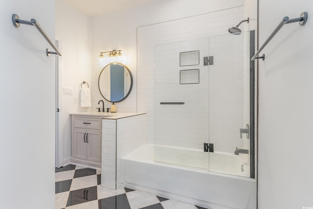 bathroom featuring vanity, tile patterned floors, and bath / shower combo with glass door