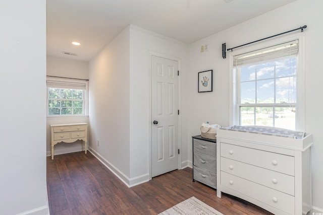 interior space with dark wood-style floors, visible vents, recessed lighting, and baseboards