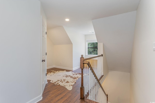 additional living space with hardwood / wood-style flooring, recessed lighting, baseboards, and lofted ceiling