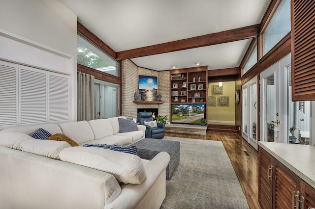 living room featuring french doors, a fireplace, lofted ceiling with beams, and dark wood-type flooring