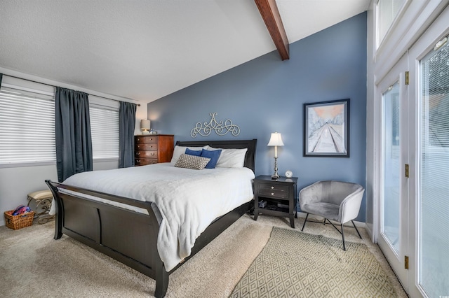 bedroom featuring carpet floors and lofted ceiling with beams