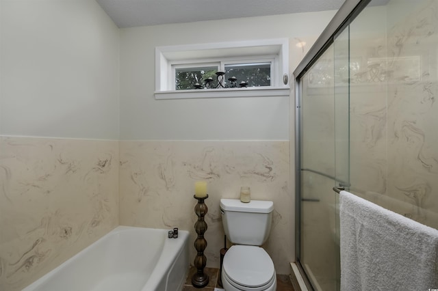 bathroom featuring a textured ceiling, shower with separate bathtub, tile walls, and toilet