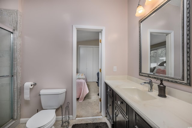 bathroom featuring vaulted ceiling, a shower with shower door, vanity, and toilet