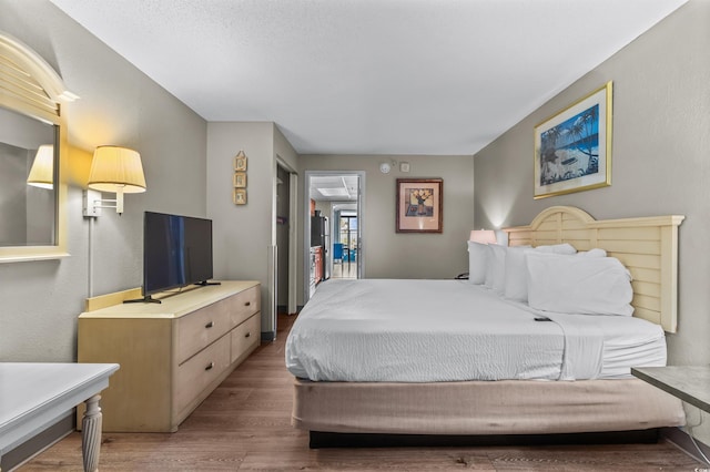 bedroom featuring wood-type flooring