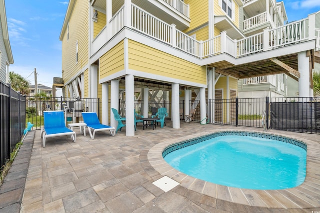 view of pool featuring a patio