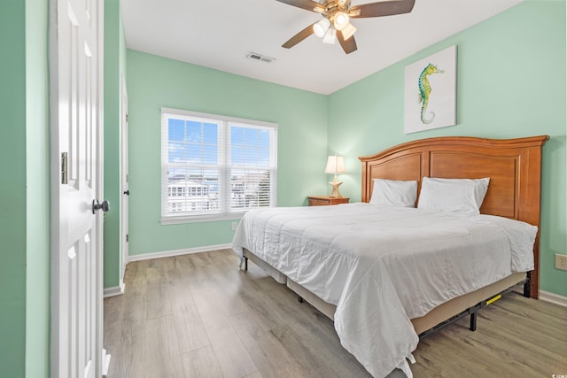 bedroom featuring ceiling fan and light hardwood / wood-style floors