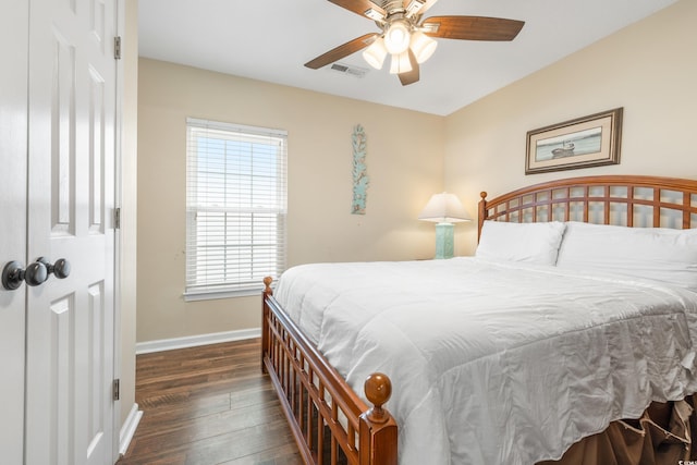 bedroom featuring dark hardwood / wood-style flooring and ceiling fan