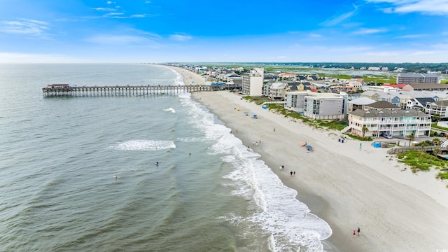 birds eye view of property featuring a water view and a view of the beach