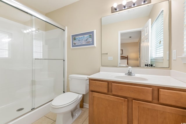 bathroom featuring vanity, toilet, a chandelier, walk in shower, and tile patterned flooring