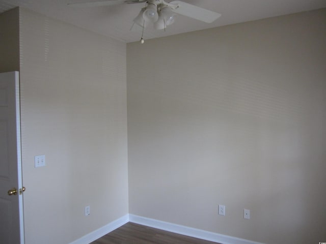 empty room with ceiling fan and wood-type flooring