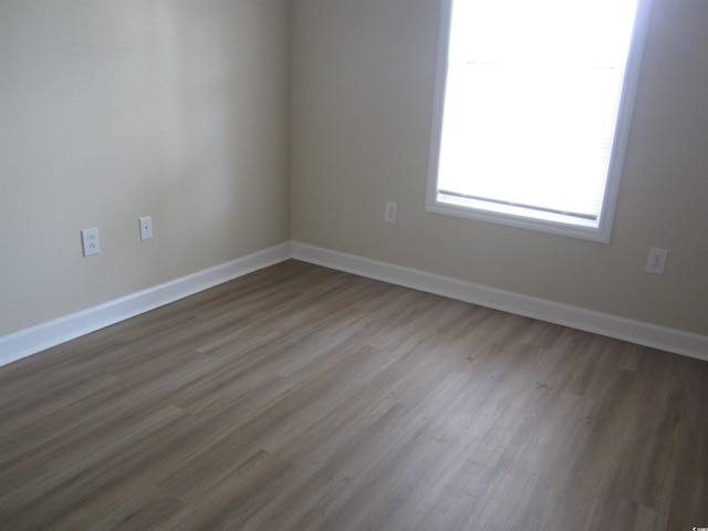 unfurnished room featuring hardwood / wood-style floors