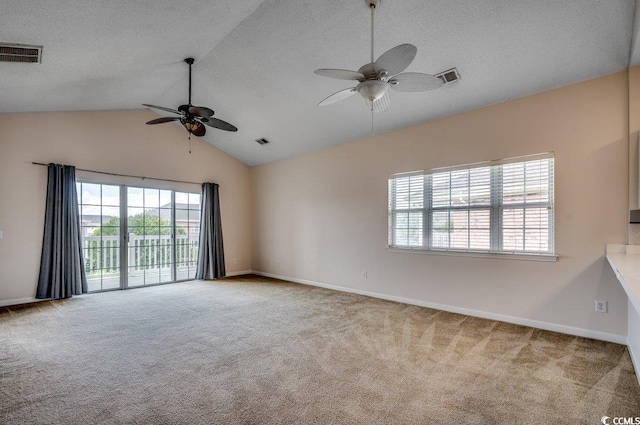 unfurnished room with a textured ceiling, visible vents, and light colored carpet