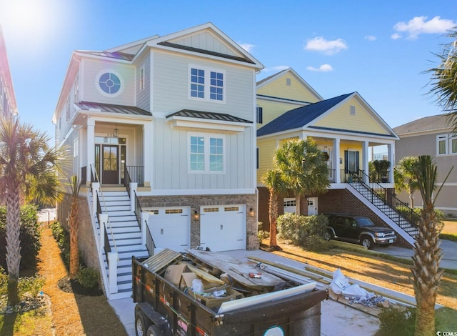 view of front of house with a porch and a garage