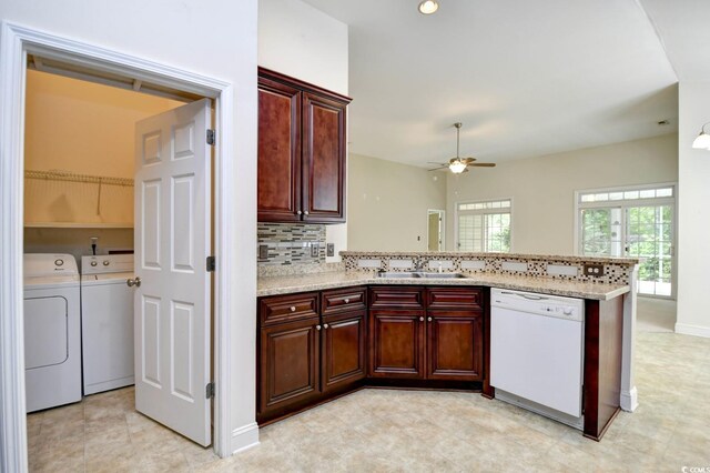 kitchen with white dishwasher, separate washer and dryer, light tile patterned floors, sink, and ceiling fan