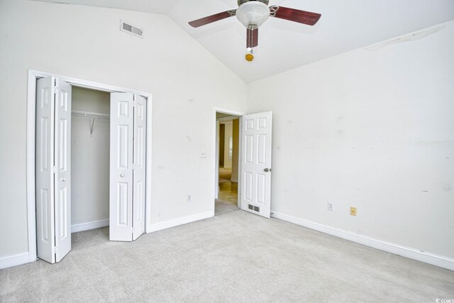 unfurnished bedroom with high vaulted ceiling, light colored carpet, and ceiling fan