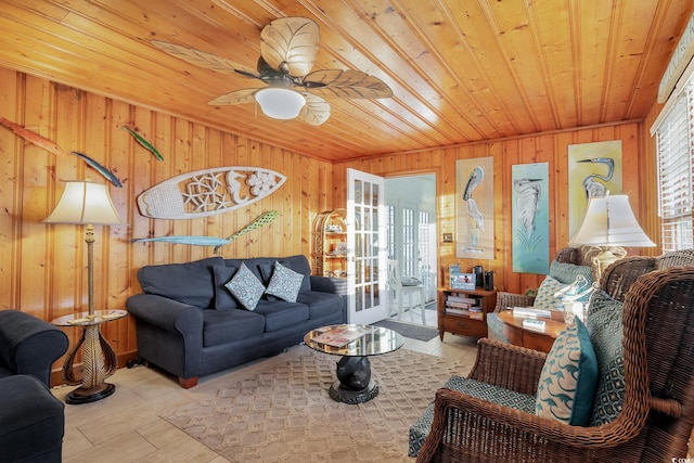 tiled living room with a wealth of natural light, wooden walls, and wooden ceiling